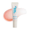 CremeBalm Fresh Origin Lip Balm tube standing in front of a glossy pink lip swatch